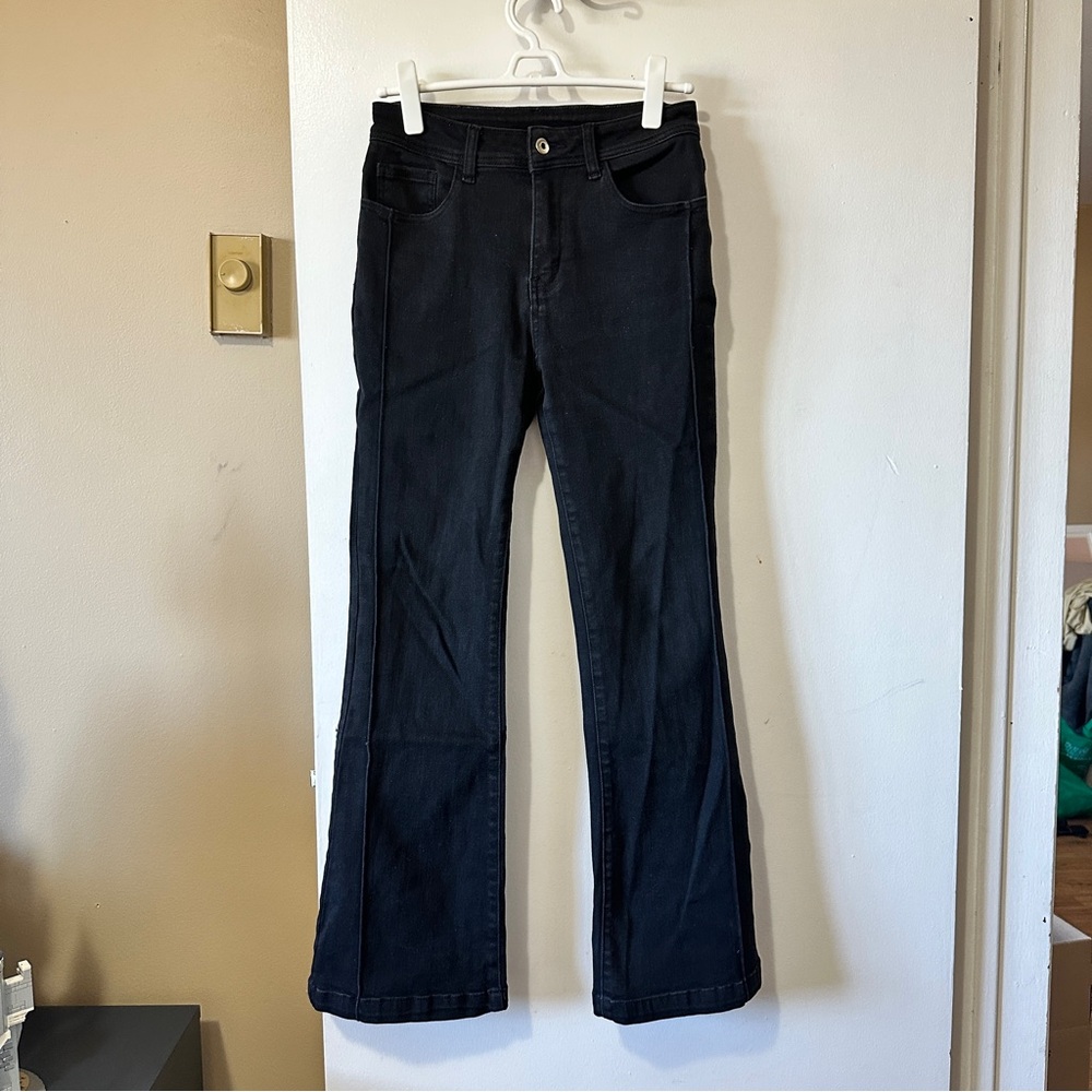 Black flare jeans with a touch of Y2K style